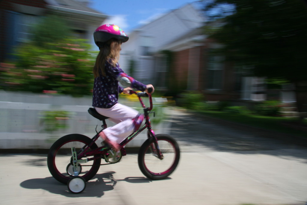 Kid riding a bike.